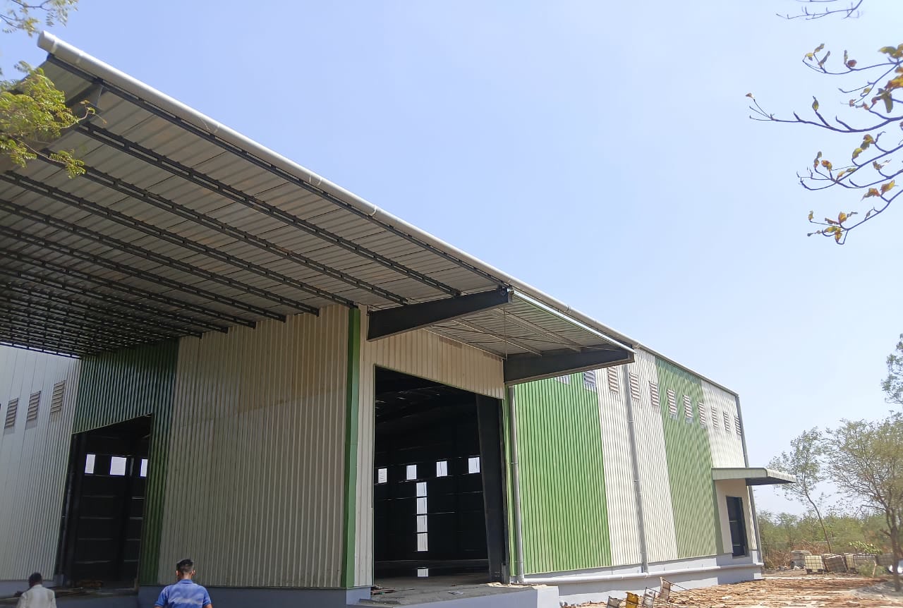Industrial building exterior used to illustrate monsoon planning for factory and warehouse projects